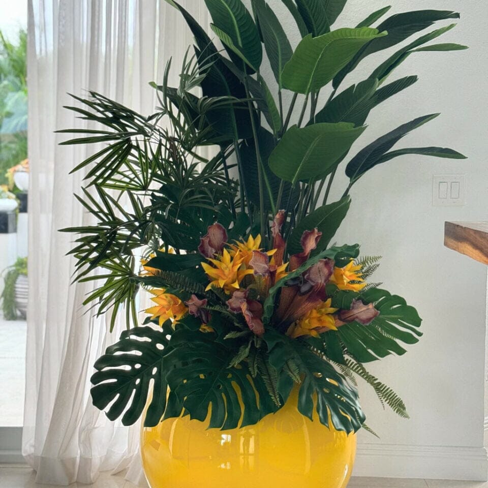 Mix of Tropical Plants in a Yellow Globe Planter The New Garden