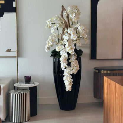 San Jose Vase in glossy black with hanging yellow orchids The New Garden 