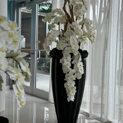 San Jose Vase in glossy black with hanging yellow orchids The New Garden 